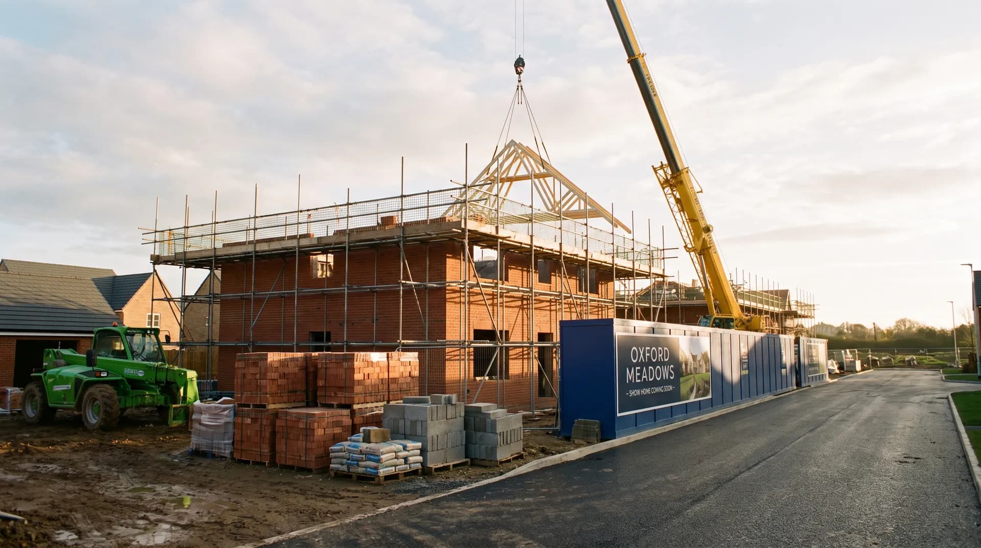 New-build show home under construction in Oxford showing brickwork and large gable window